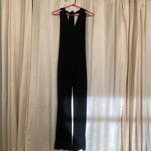 Sleek Black V-Neck Jumpsuit. Medium